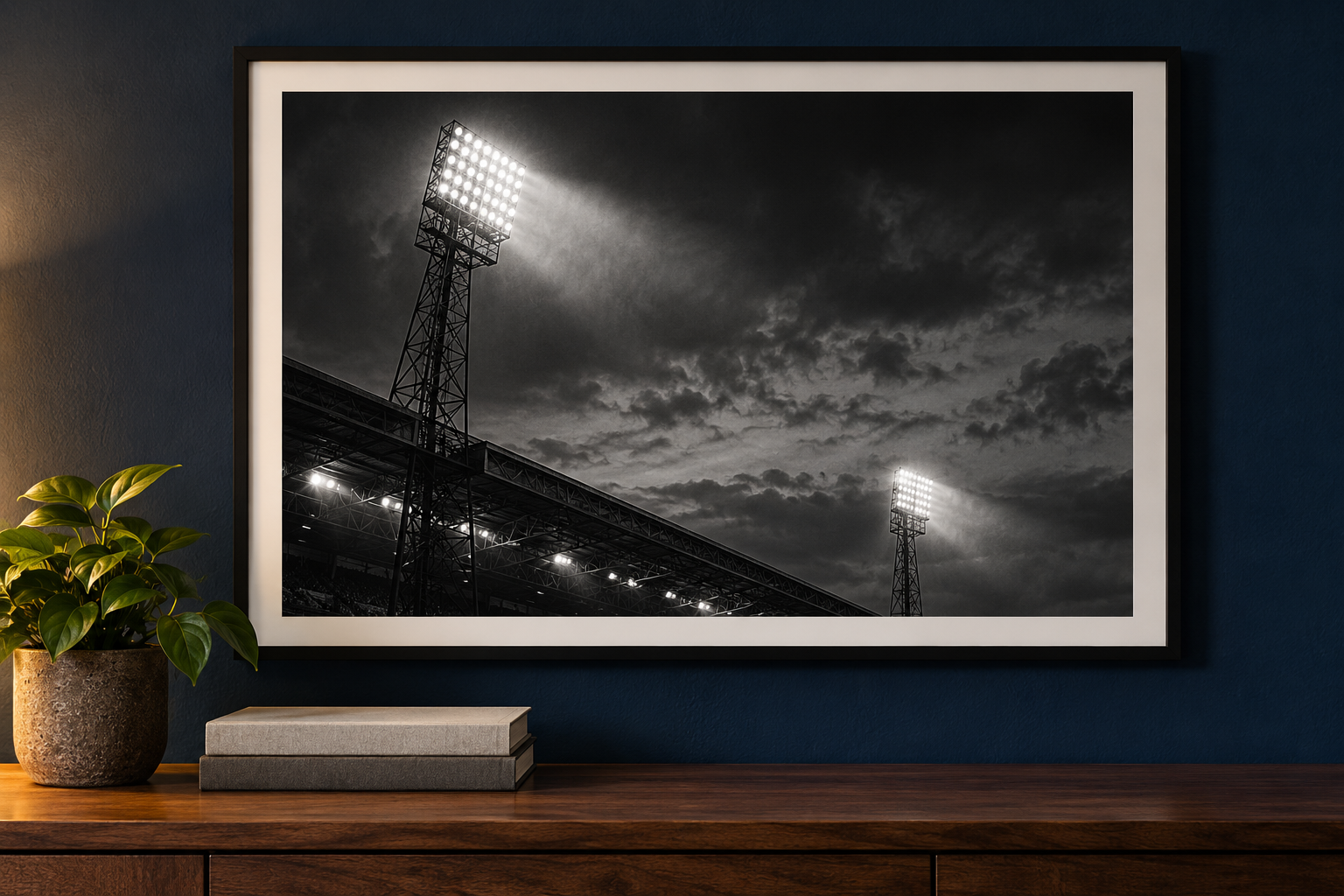 Framed football stadium floodlights poster on a navy wall